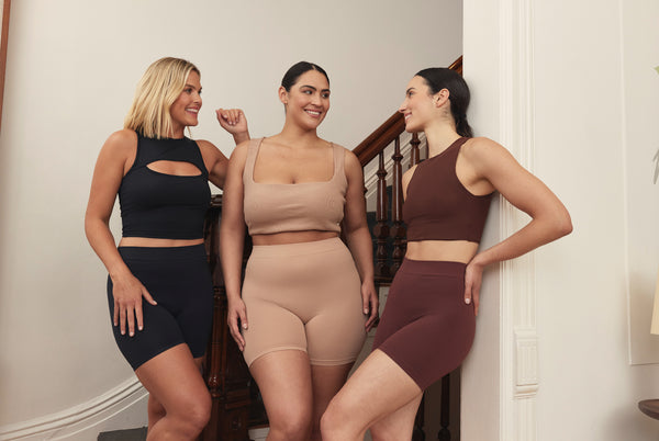 Three women wearing Thigh Society shorties